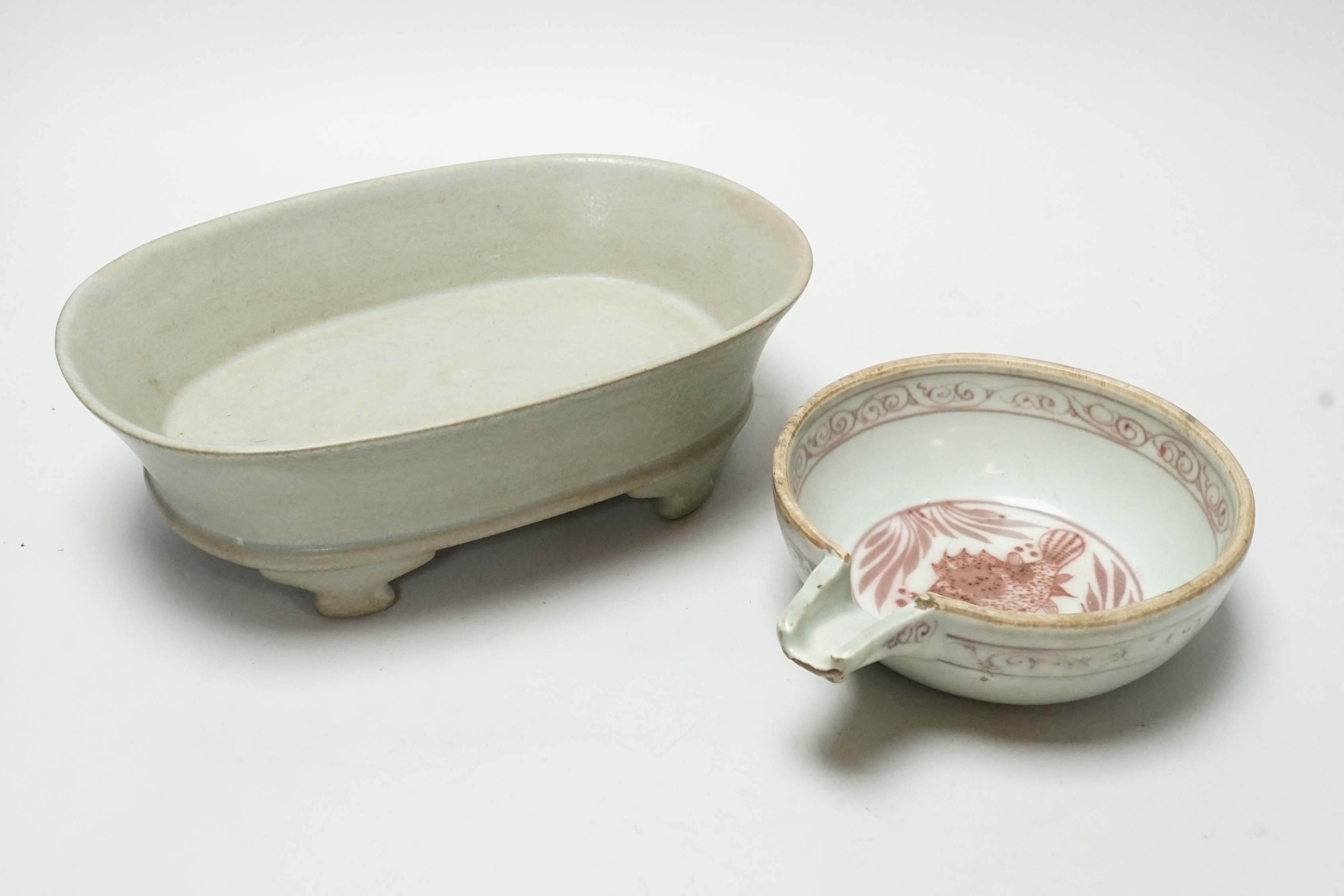 A Chinese celadon glazed dish and another, largest 24cm